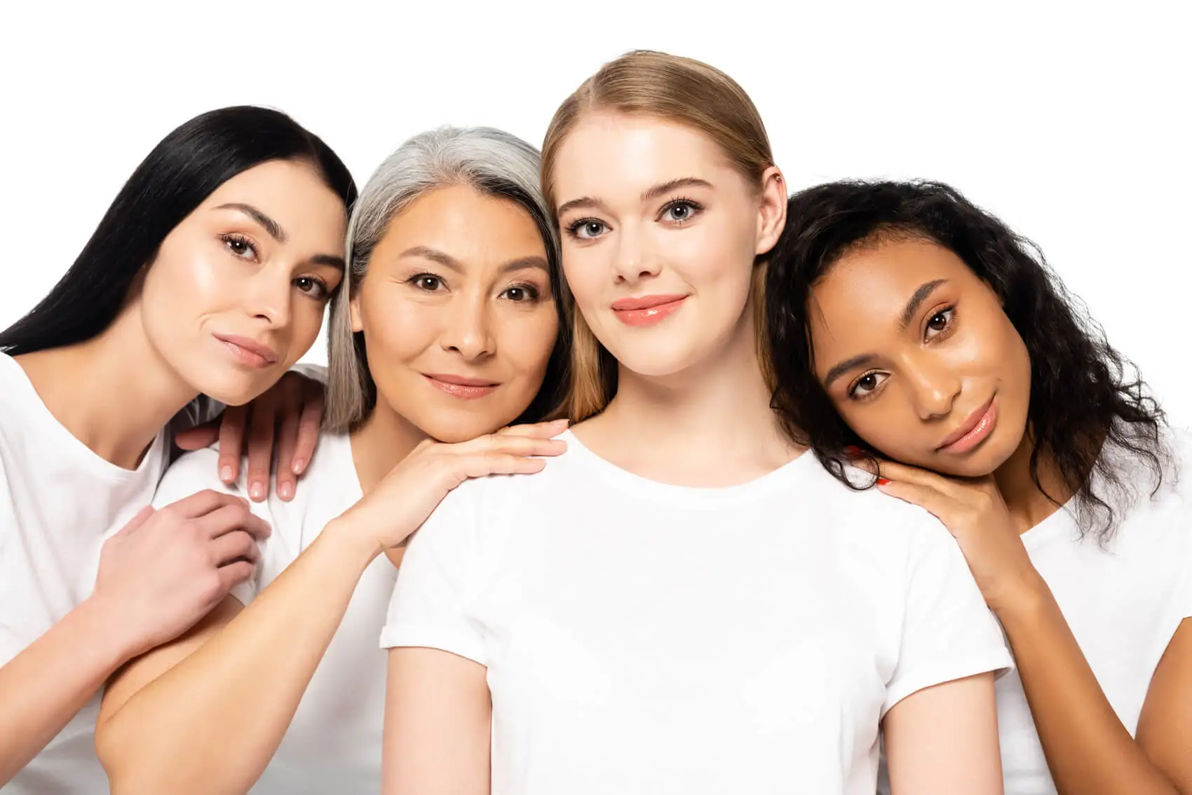 4 young women smiling and looking at the camera