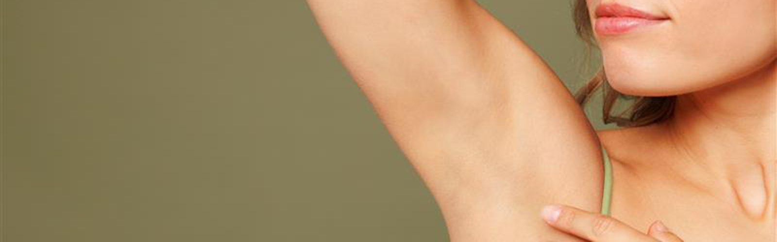 Woman with her arm raised.