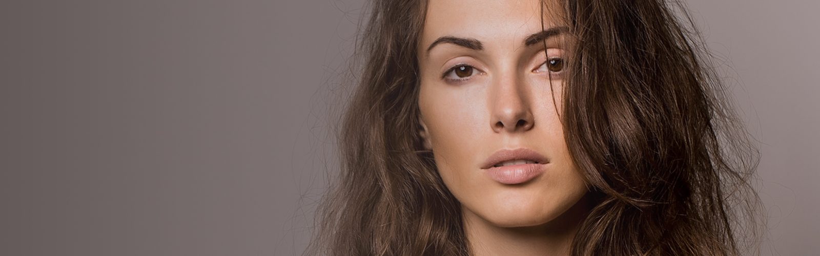 Headshot of a woman with dark hair.