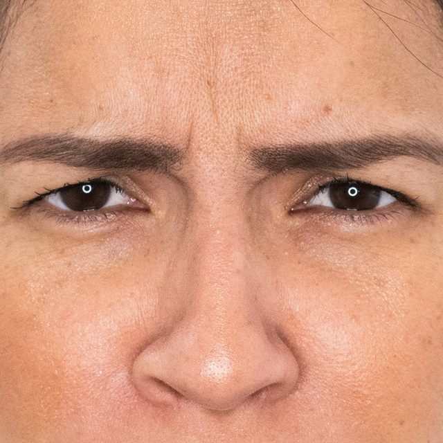Closeup of a woman's face with focus on the eye region.