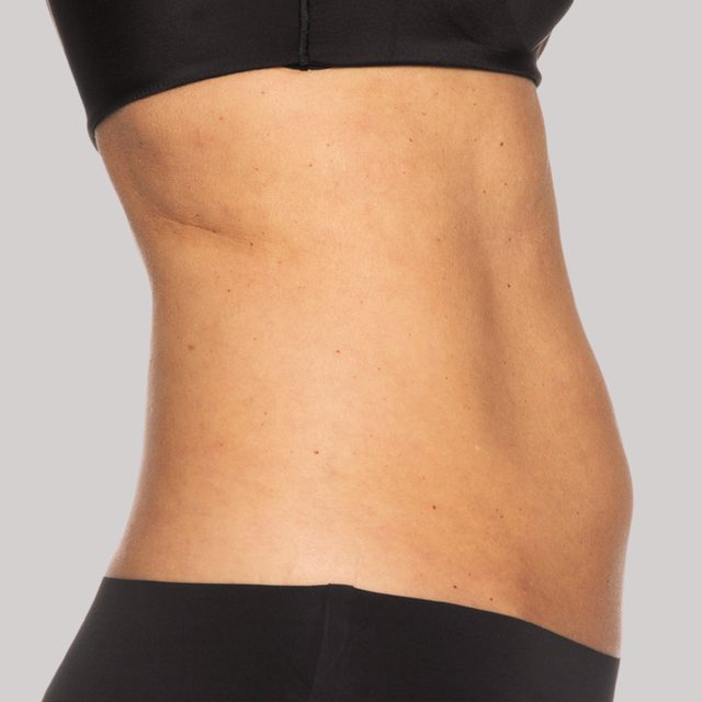 Side angle of a person's mid section while wearing black undergarments.