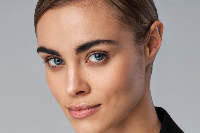 Headshot of woman with blue eyes and blonde hair.