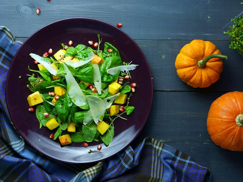 salad on table with pumpkins