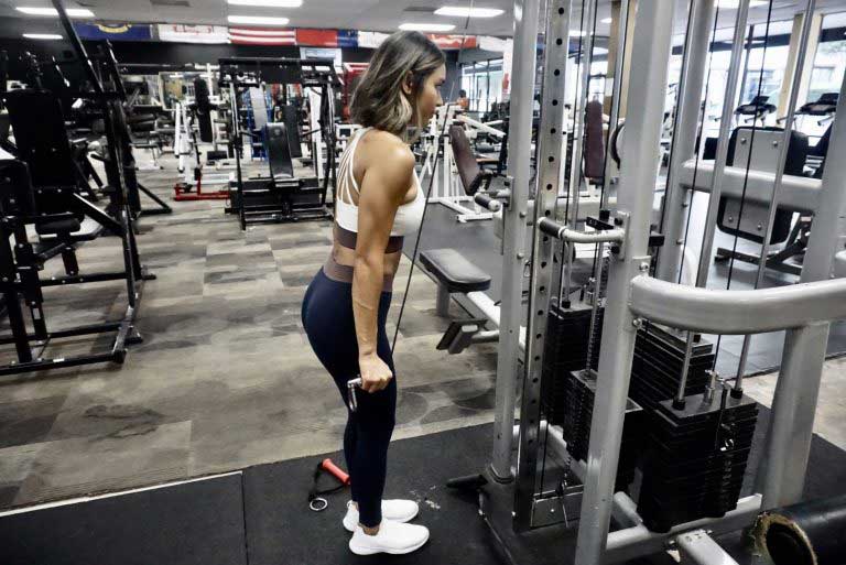 Young woman at gym working out