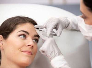 Young woman receiving Botox injection